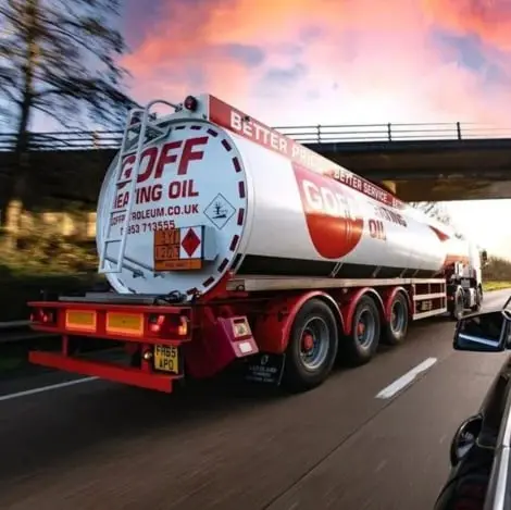 Goff Petroleum tanker driving along a motorway at sunset