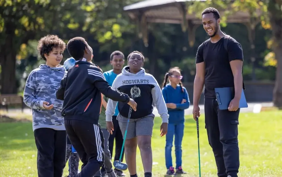 Golfway instructor with a group of young golfers